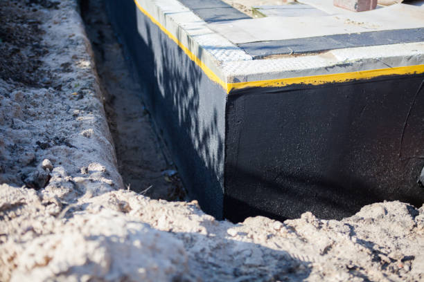Professional Basement Waterproofing technician working in Annapolis Junction, MD